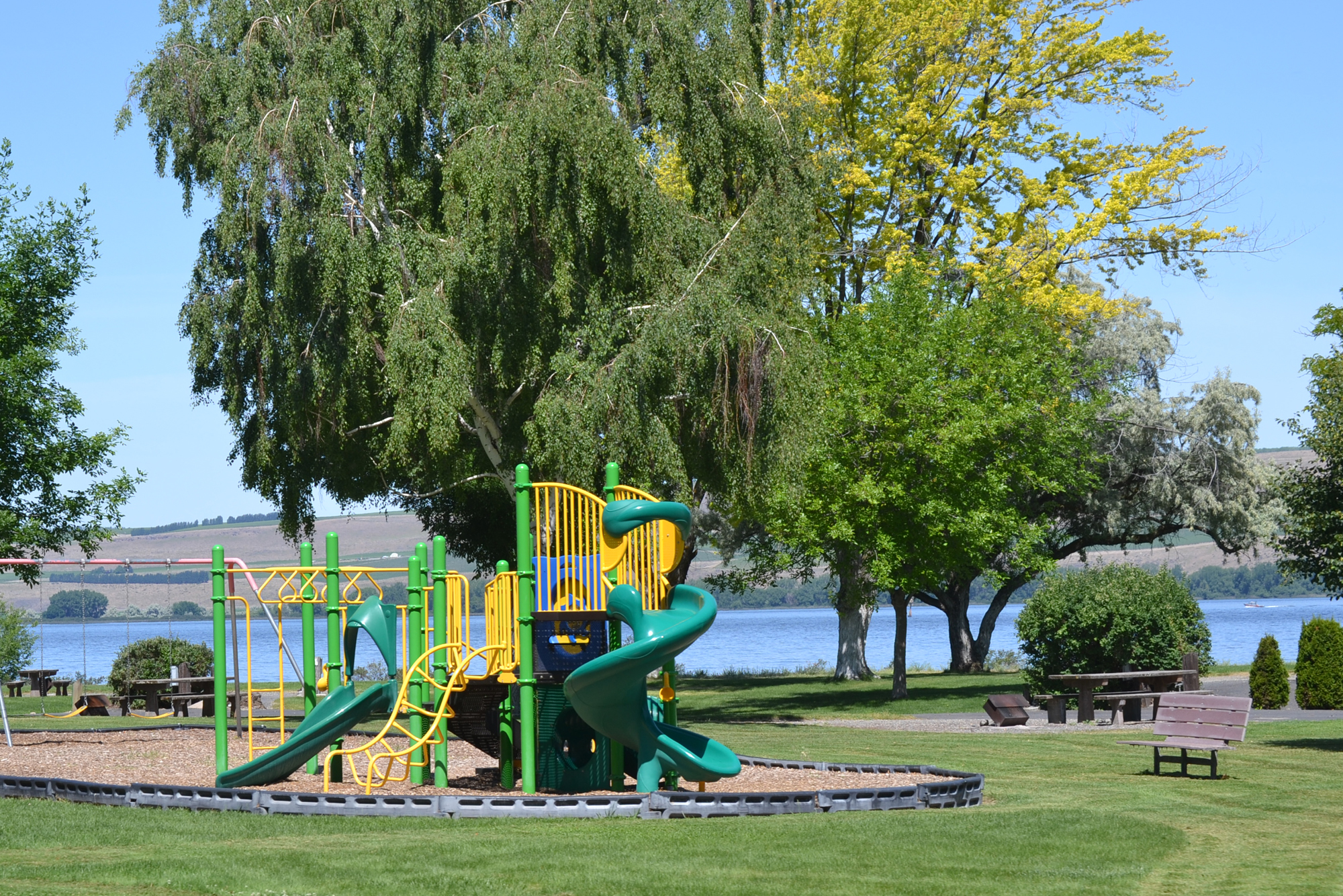 Boardman Marina Park playground with Columbia River in the background.